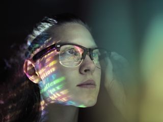 A girl lighted with colorful code