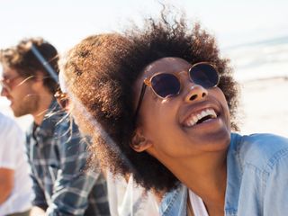 A woman smiling at beach