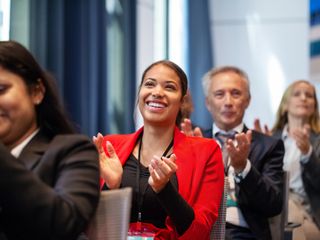 Business people applauding during launch event