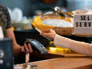 Customer paying with touchless payment