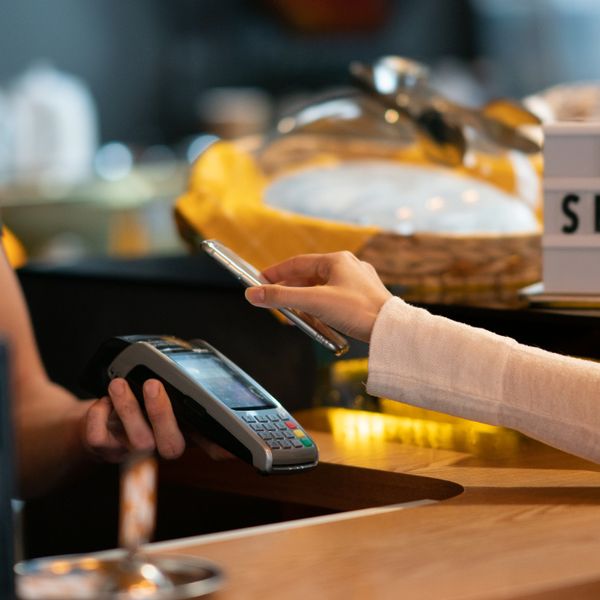 Customer paying with touchless payment