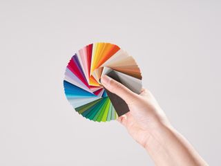 Hand holding color swatches