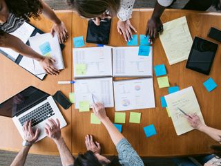 High angle view of business people planning in board room