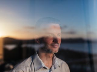 Man looking out of a window