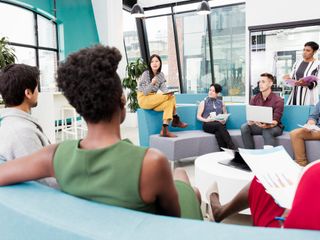 Woman leading informal meeting in office