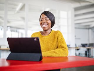 Woman smiling during a video call in office