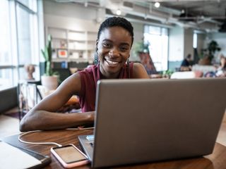 Woman working with laptop at coworking